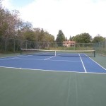 blue surface tennis court by home court